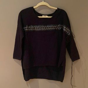 Molly Bracken, black viscose sweater, cute black leather w silver eyelet